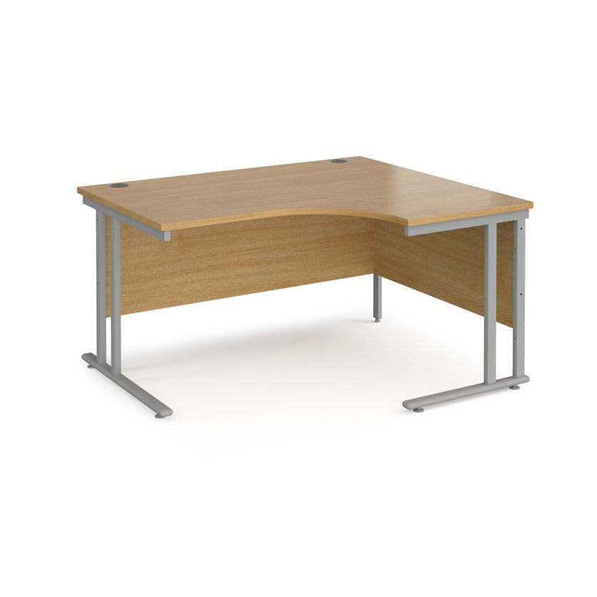 A right-hand ergonomic desk with a beech melamine tabletop and cantilever metal frame.