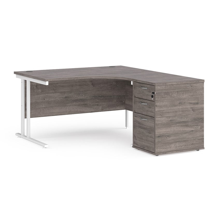 A right-hand configurations office desk with a pedestal storage unit, in a grey wood finish with a cantilever frame.