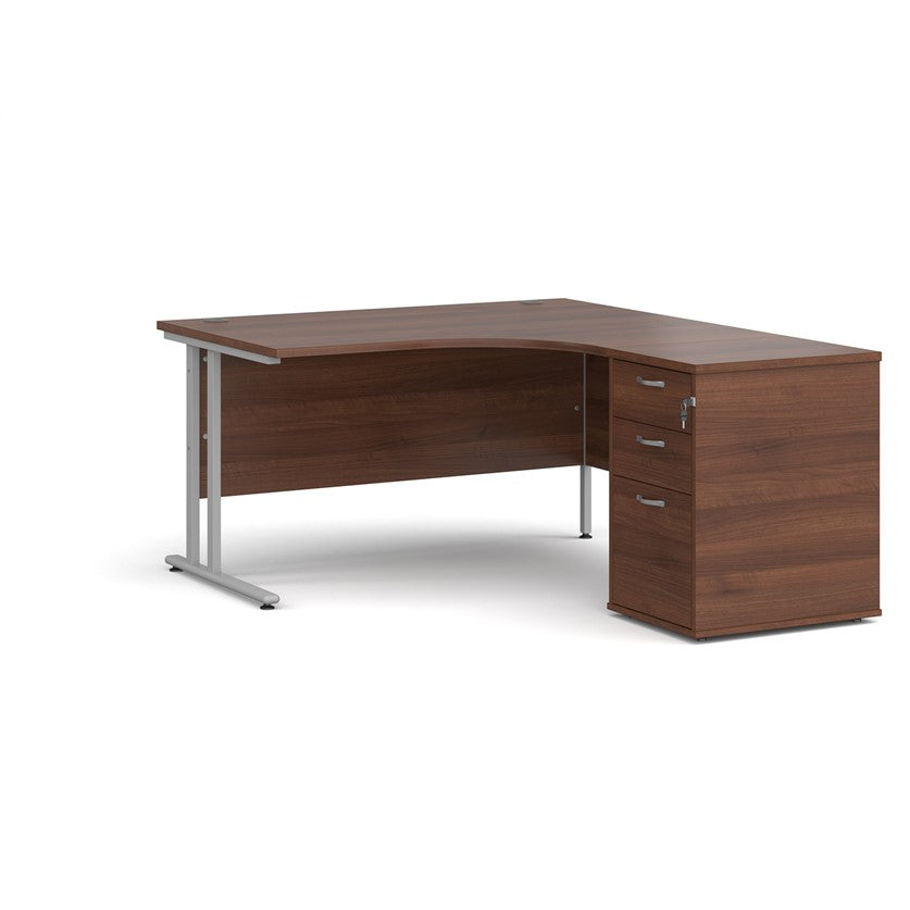 A right-hand configurations office desk with a pedestal storage unit, in a walnut wood finish with a silver cantilever frame.