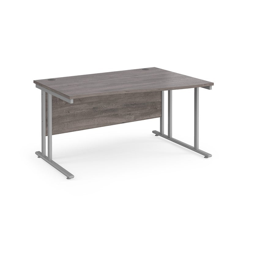A rectangular office desk with a grey melamine tabletop and cantilever metal legs.