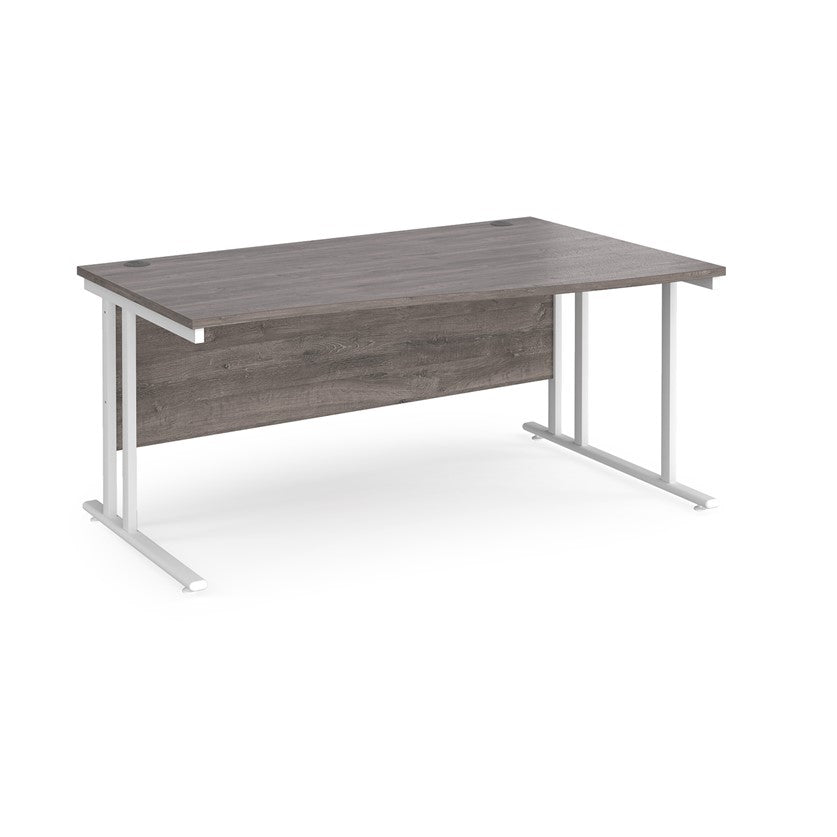 A rectangular office desk with a grey  tabletop and white cantilever metal legs.
