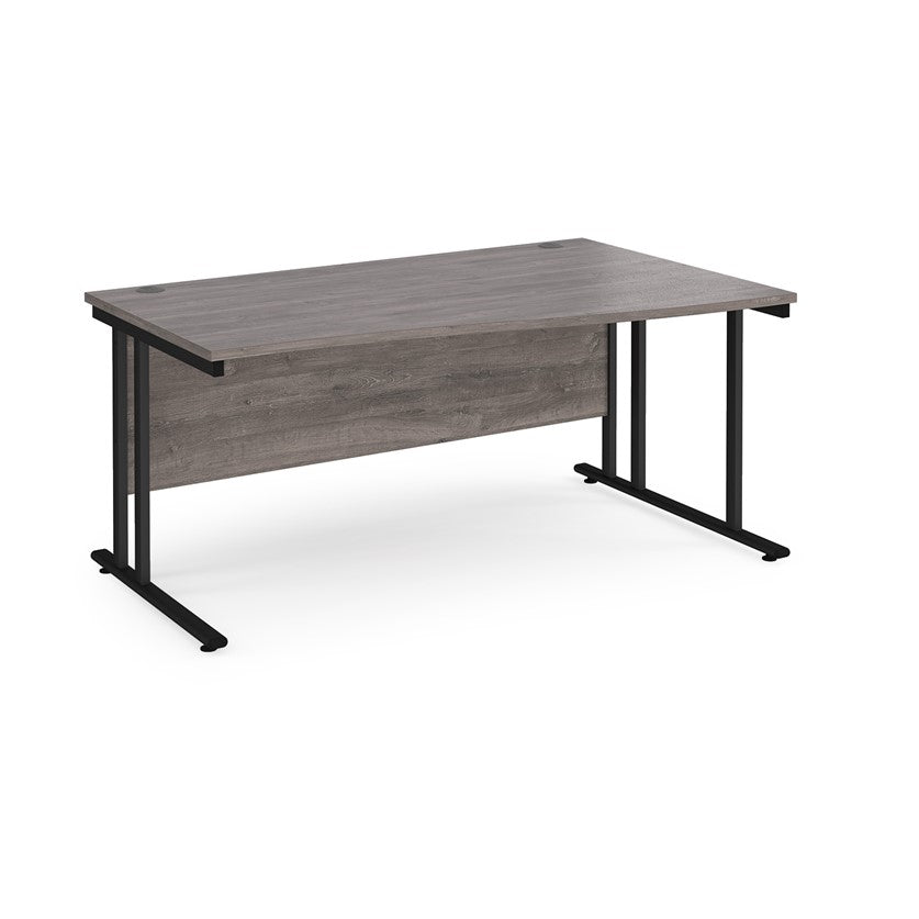 A rectangular office desk with a grey  tabletop and black cantilever metal legs.
