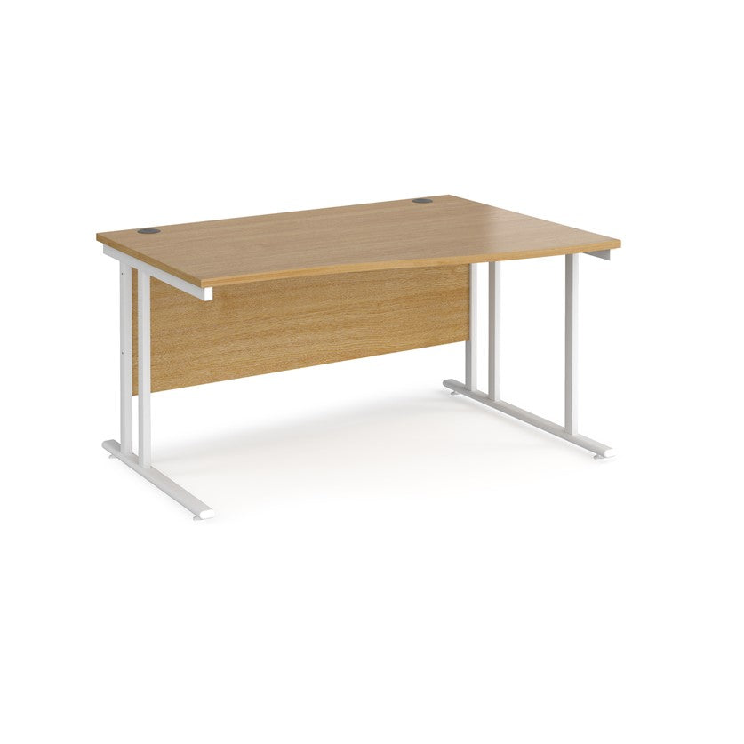 A rectangular office desk with a beige melamine tabletop and cantilever metal legs.