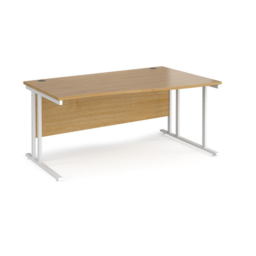 A rectangular office desk with a beige melamine tabletop and white cantilever metal legs.
