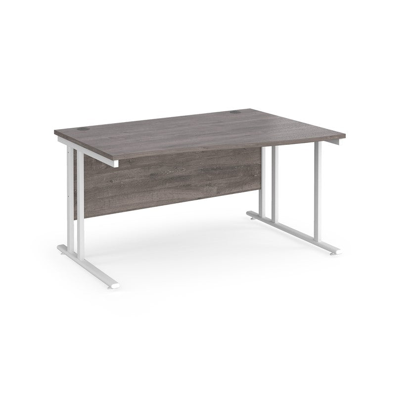 A rectangular office desk with a grey melamine tabletop and cantilever metal legs.