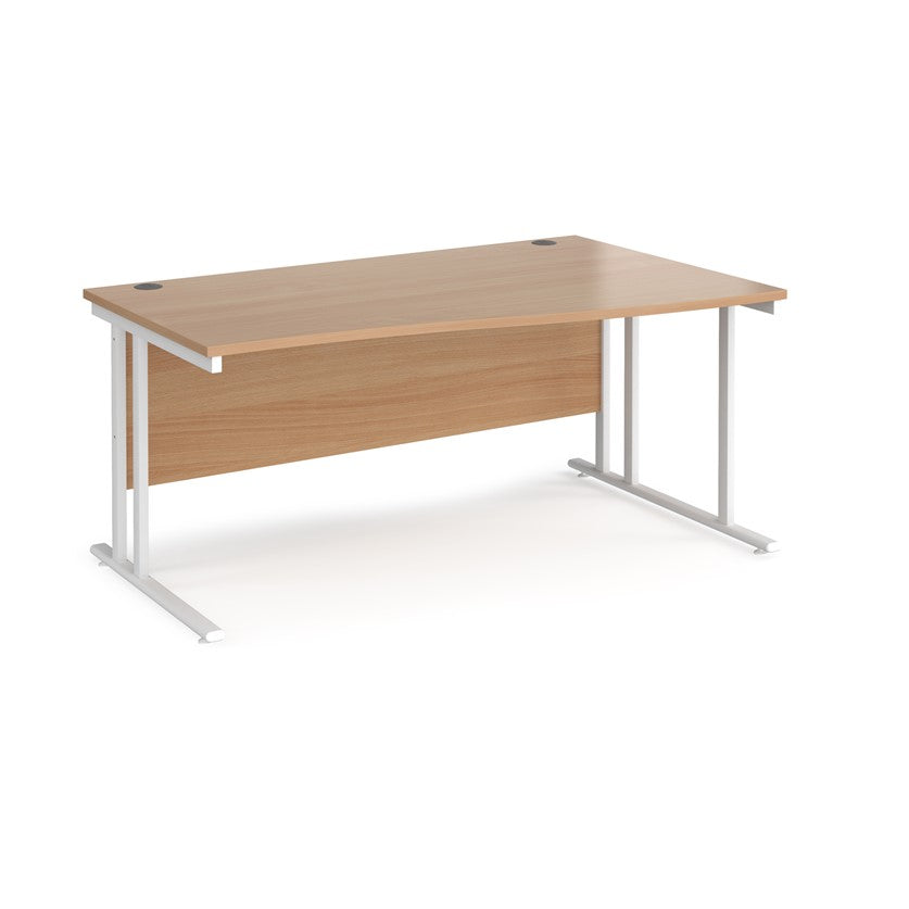 A rectangular office desk with a beige melamine tabletop and cantilever metal legs.

