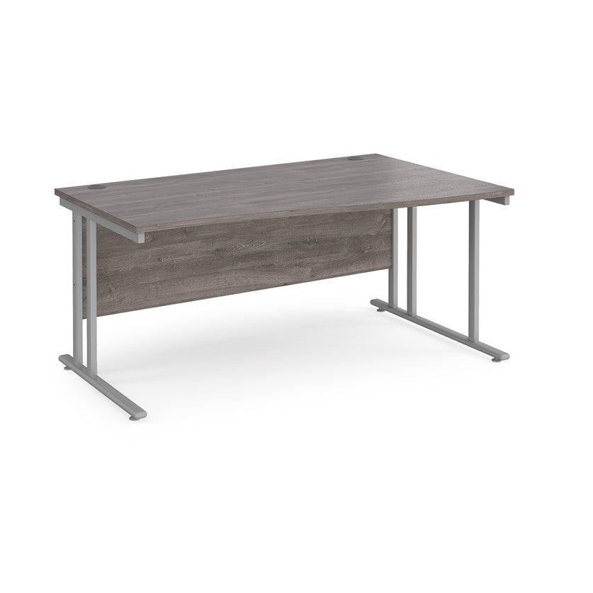 A rectangular office desk with a grey  tabletop and grey cantilever metal legs.

