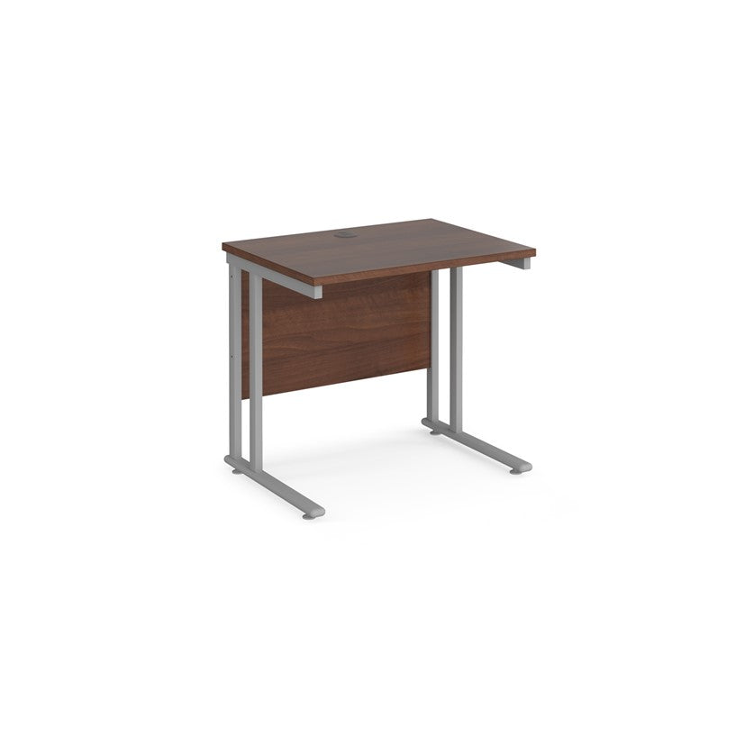 A walnut desk with a grey cantilever frame.