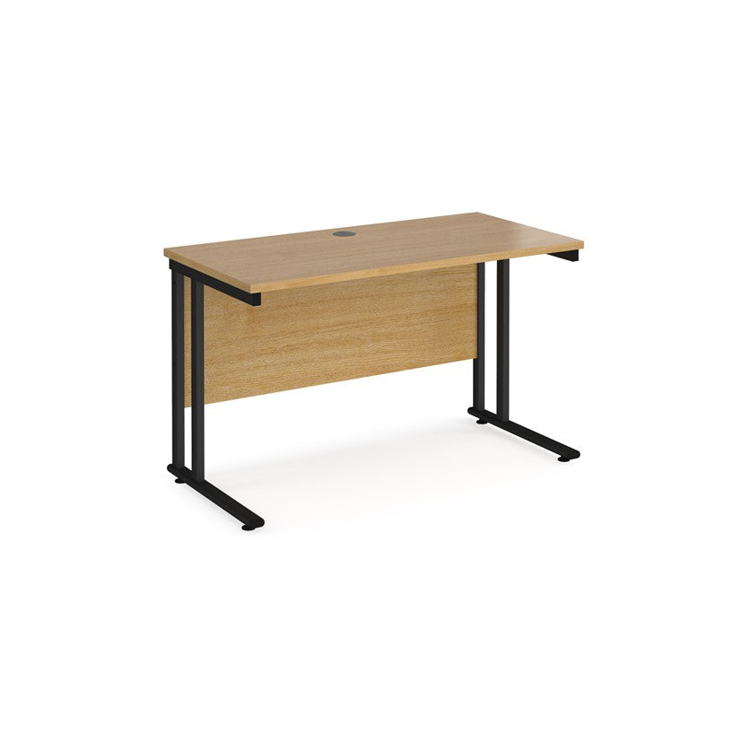 An oak desk with a black cantilever frame.