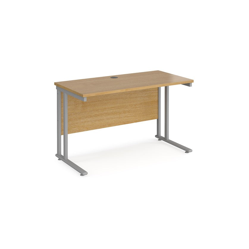 An oak desk with a grey cantilever frame.