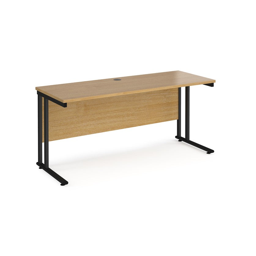 An oak desk with a black cantilever frame. 