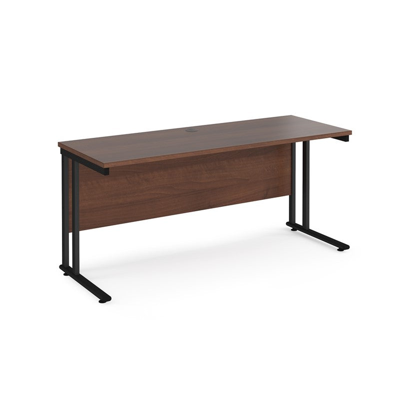 A walnut desk with a black cantilever frame.