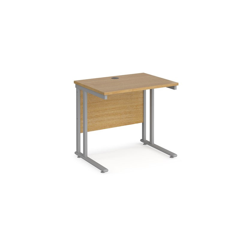 A rectangular office desk with a cantilever frame and a beige melamine desktop, featuring one cable access port.