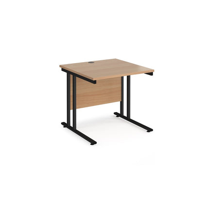A rectangular office desk with a black cantilever frame and melamine desktop, with one cable access port visible.