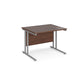 A walnut desk with a grey cantilever frame.