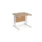 A rectangular office desk with cantilever frame and melamine desktop, with one cable access port visible.