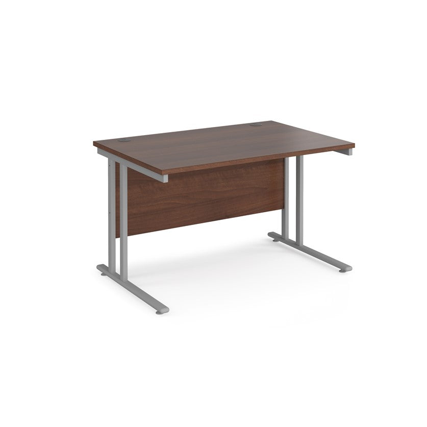 A walnut desk with a grey cantilever frame. 