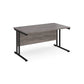 A grey desk with a black cantilever frame.