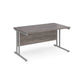 A grey desk with a grey cantilever frame.