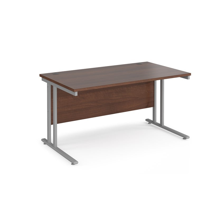 A walnut desk with a grey cantilever frame. 