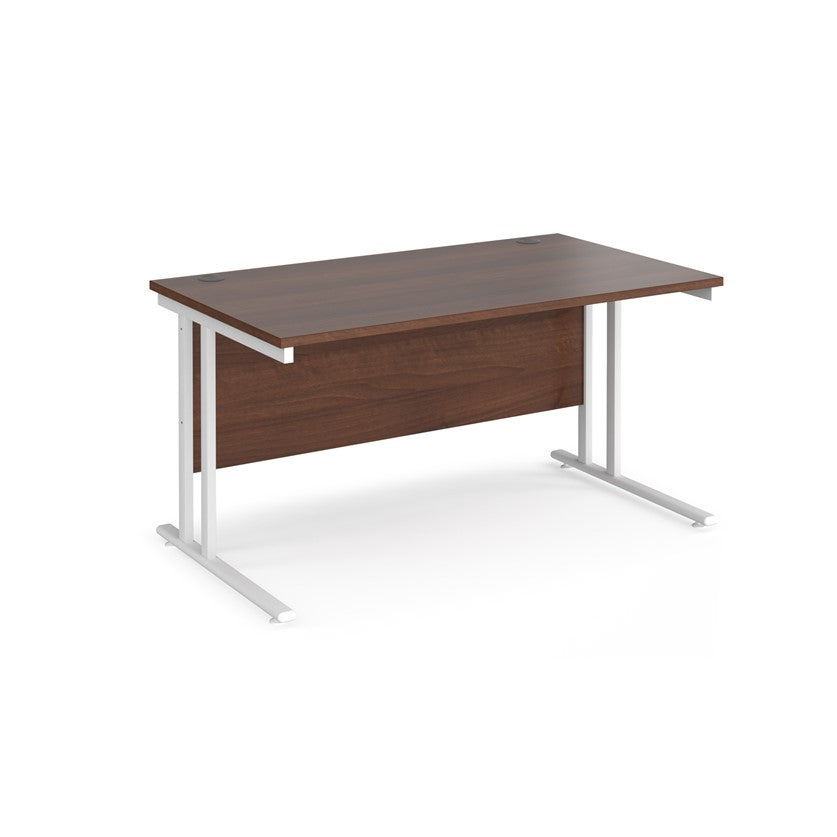 A walnut desk with a white cantilever frame.