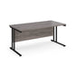 A grey desk with a black cantilever frame.