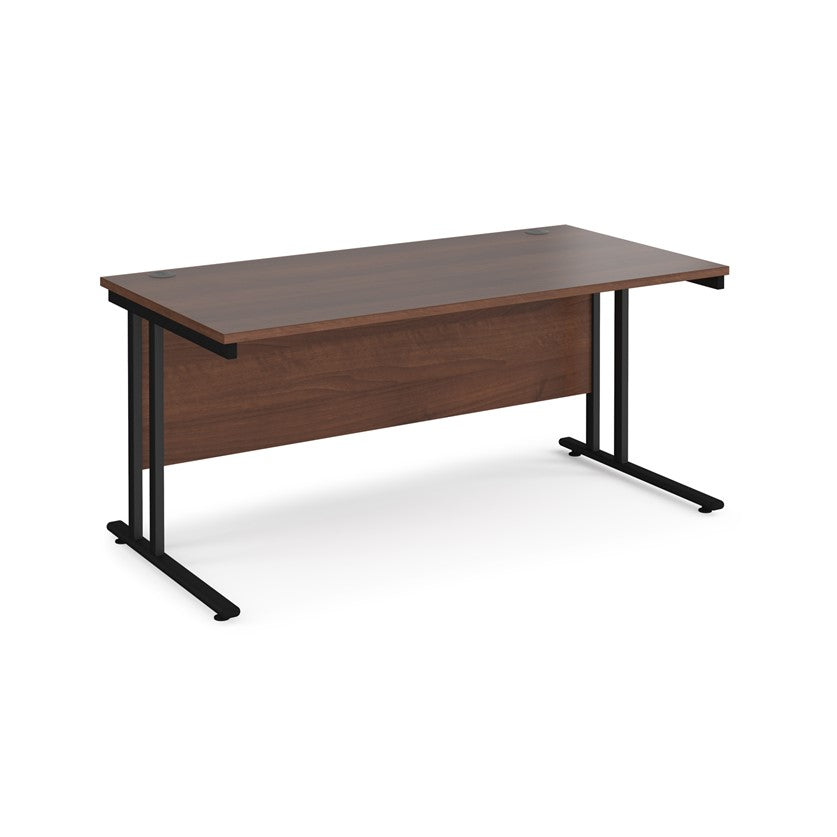 A walnut desk with a black cantilever frame.