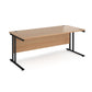 A beech desk with a black cantilever frame. 