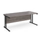 A grey desk with a black cantilever frame. 