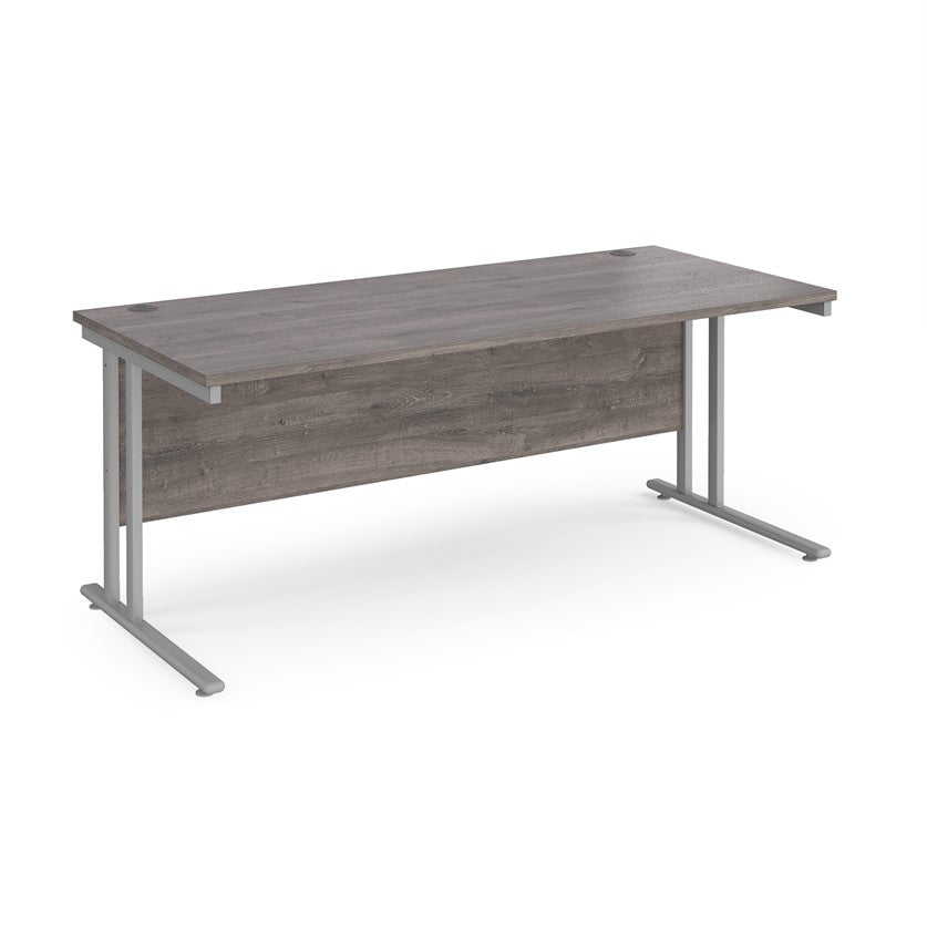 A grey desk with a grey cantilever frame.