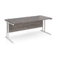 A grey desk with a white cantilever frame.