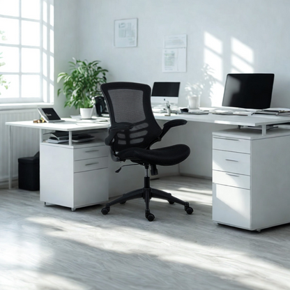 Modern office setup with a white desk, black chair, and computer equipment.