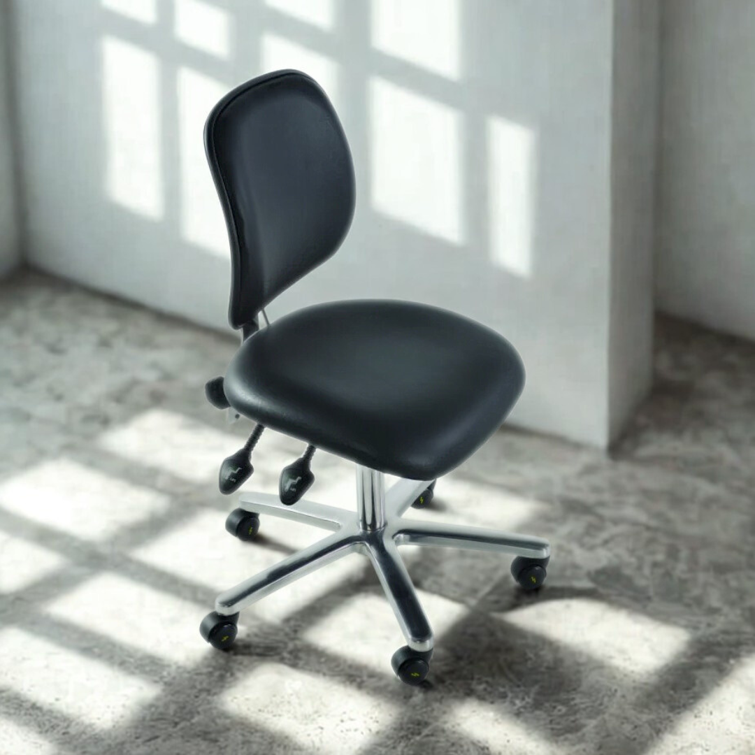 Black office chair in a room with sunlight casting shadows on the floor