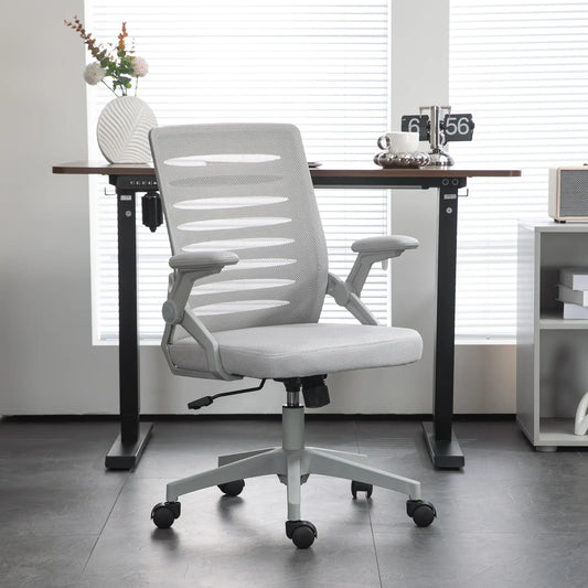 White office chair in front of a desk with a blurred background