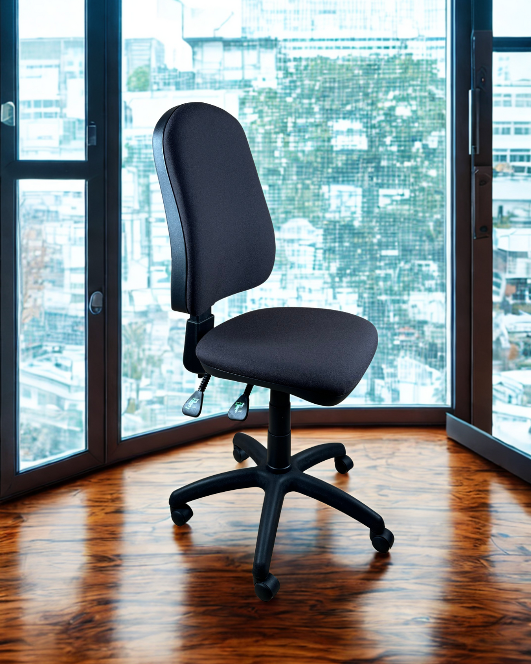 Almost office chair in front of large windows with a cityscape view