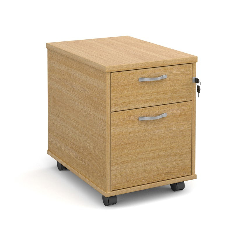 A oak wood mobile pedestal with two drawers and silver metal handles on wheels.