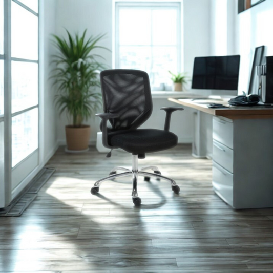 Modern office setup with a black chair, desk, and computer in a bright room.