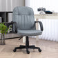 Gray office chair in a home office setting with a desk and decor.