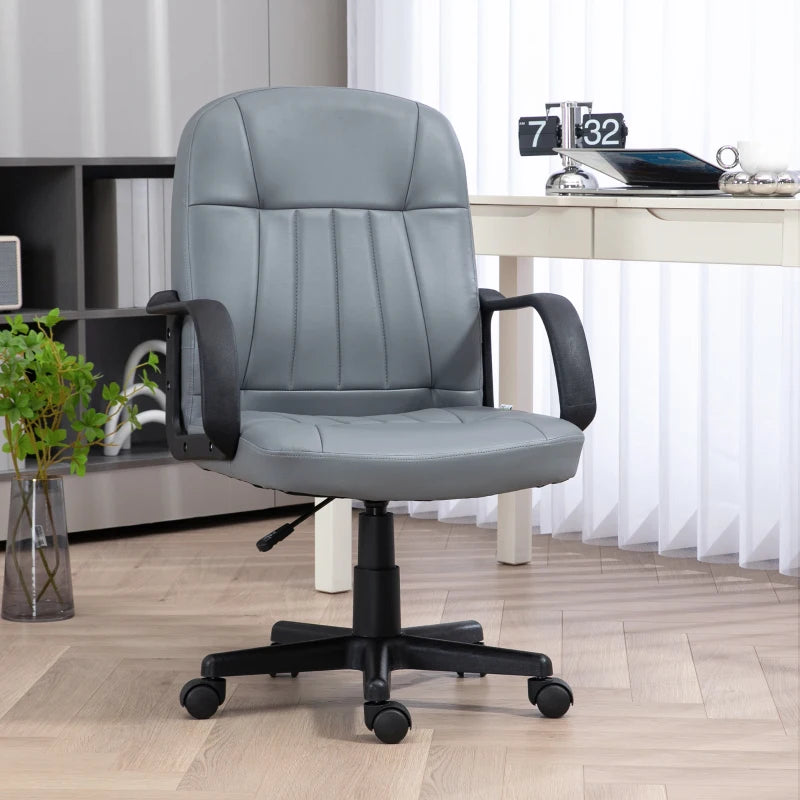 Gray office chair in a home office setting with a desk and decor.