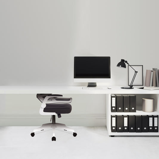 Modern office desk with computer, chair, and shelves against a white wall.