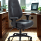 Black office chair in a home office setting with a desk and computer.