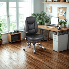 Black office chair in a home office setting with a desk and computer.