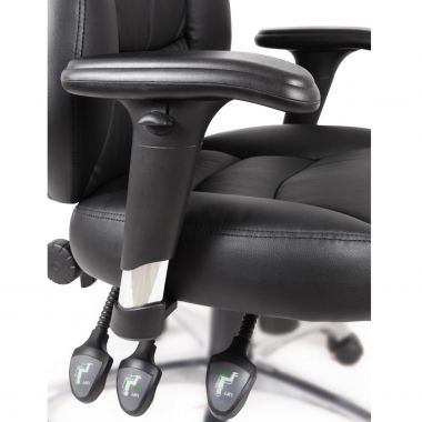 Close-up of a black office chair with armrests and footrest on a white background
