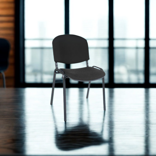 Black chair in a room with large windows
