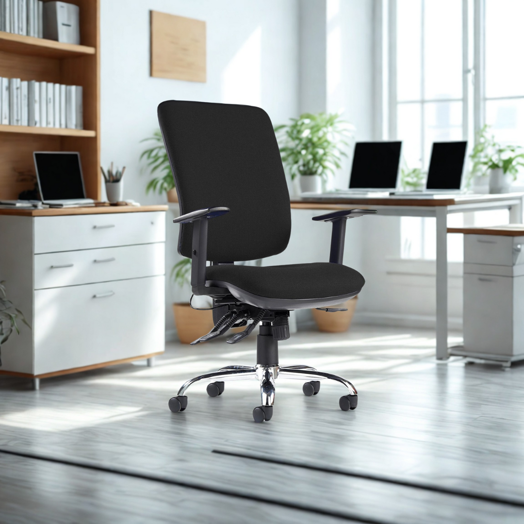 Black office chair in a modern office setting with desks and plants.