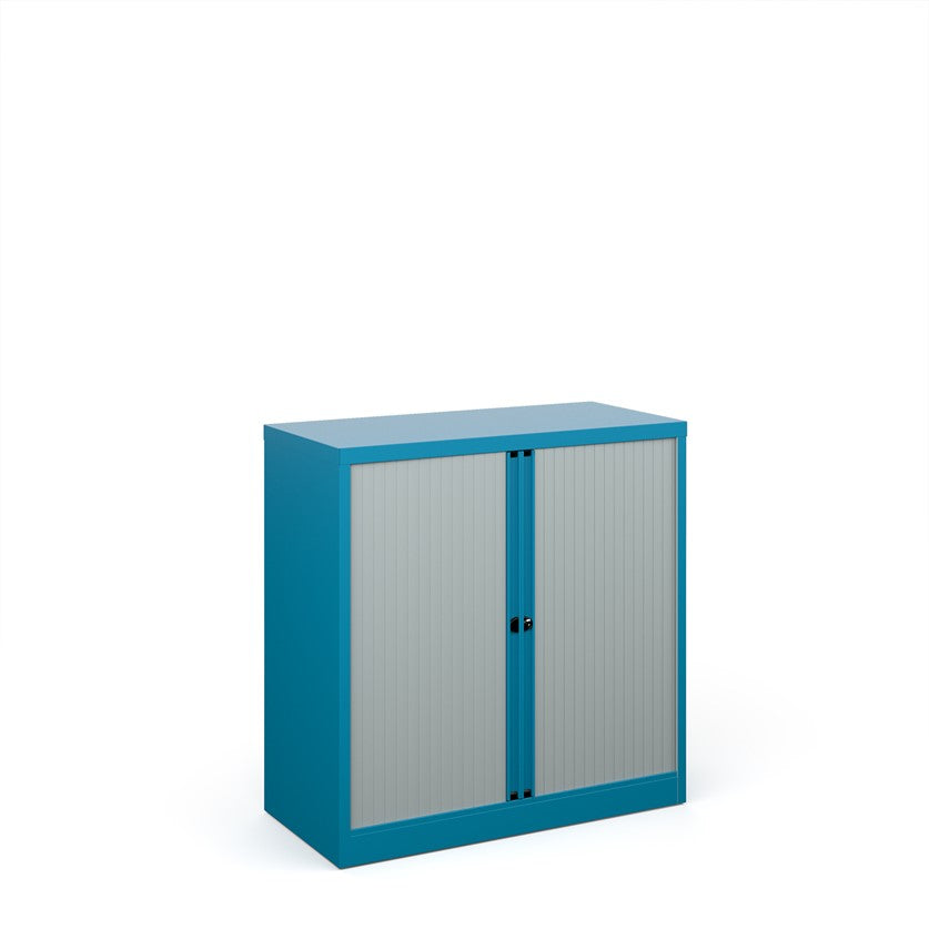 A blue storage cabinet with tambour doors, fully assembled, with no visible shelves inside.