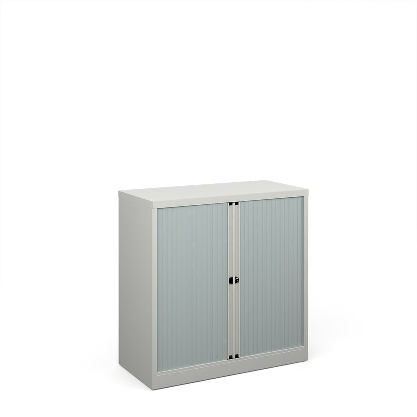 A silver storage cabinet with tambour doors, fully assembled, with no visible shelves inside.