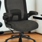 Black office chair with mesh back in an indoor setting