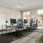 Modern office setup with ergonomic chairs and a desk.