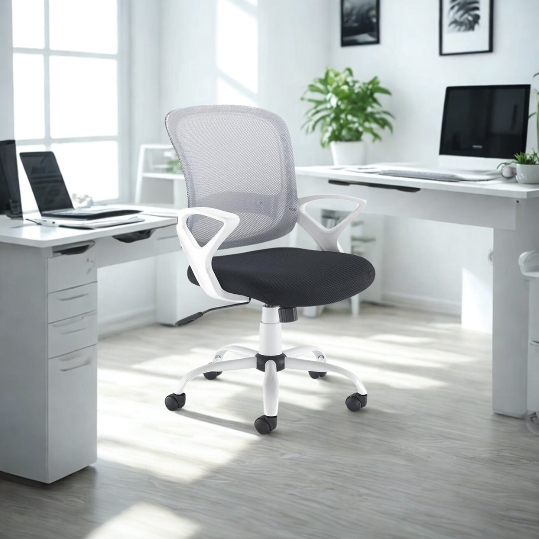 Modern office setup with a gray office chair in front of a white desk.